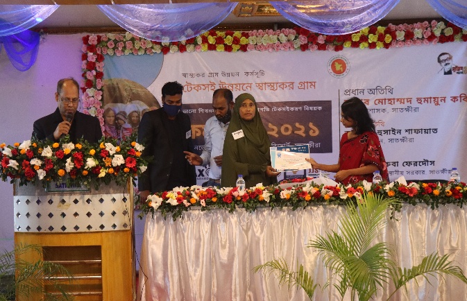 Community health information signboard displaying village health indicators
