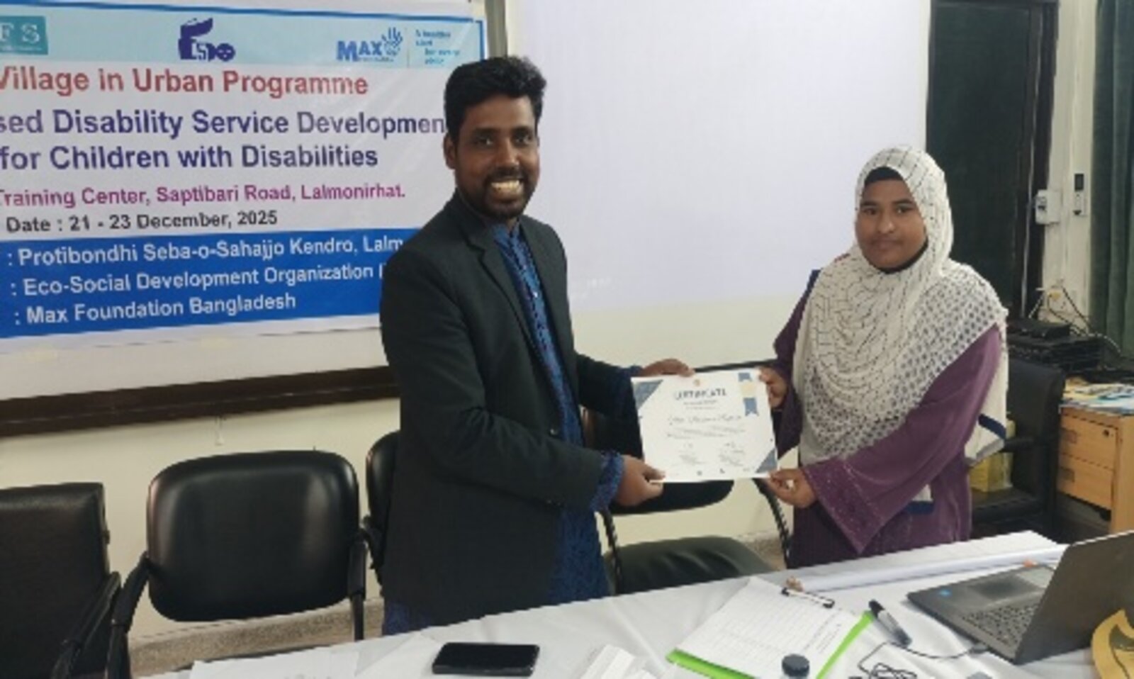 Woman entrepreneur receiving certificate